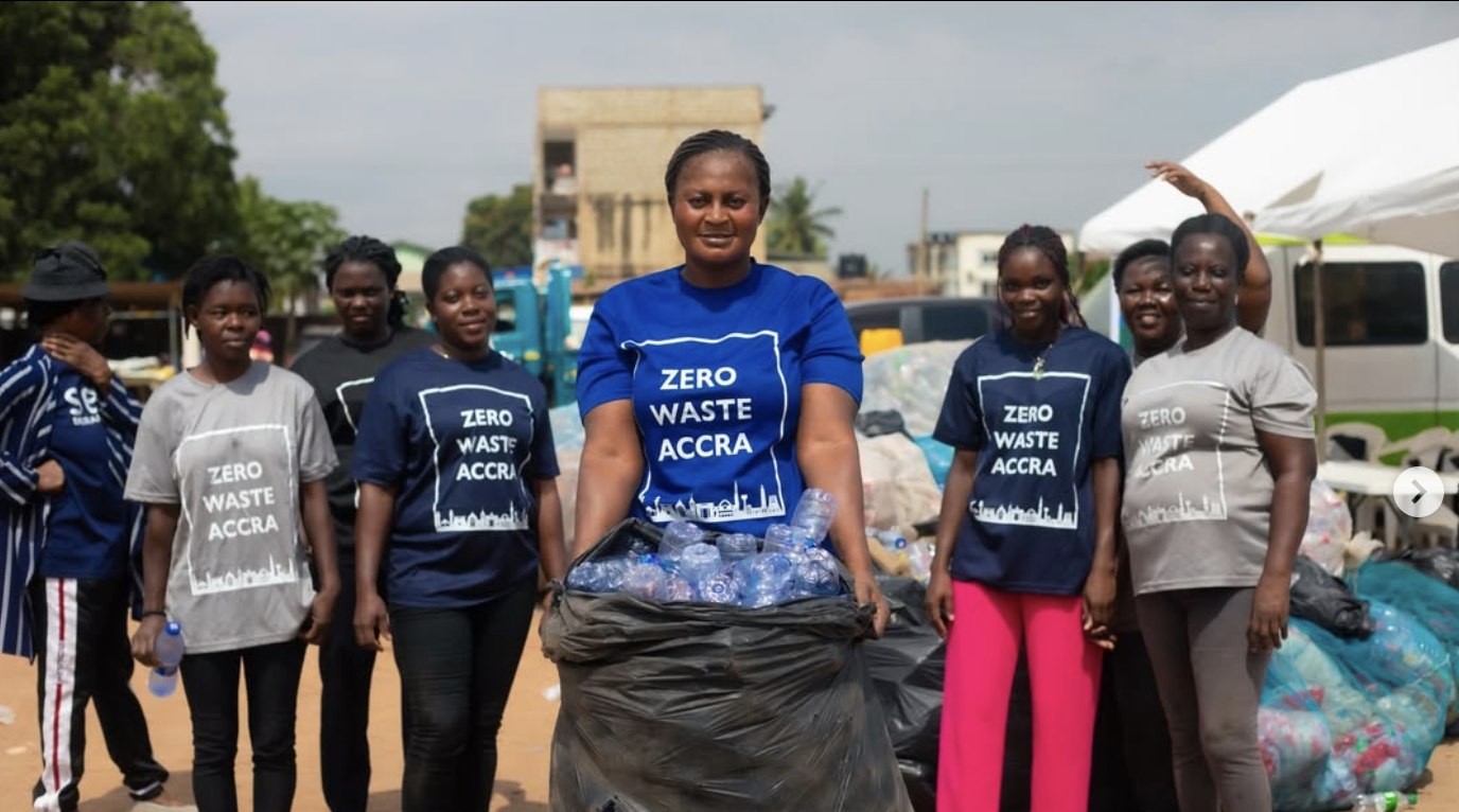 SESA team members wearing Zero Waste Accra shirts carrying a bag of collected PET bottles